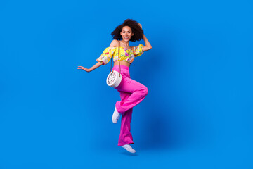 Sticker - Full size portrait of excited carefree lady jumping have good mood isolated on blue color background