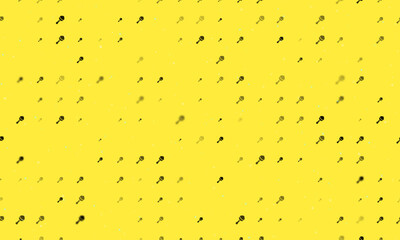 Poster - Seamless background pattern of evenly spaced black baby rattle symbols of different sizes and opacity. Vector illustration on yellow background with stars