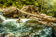 Man Bathing In Mountain River