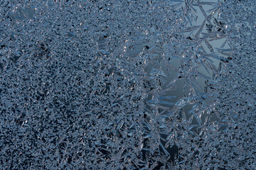 Poster - Frosty winter background photo of ice buildup on a window.