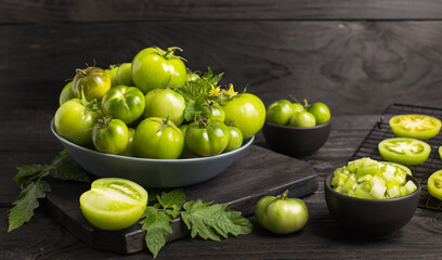 Wall Mural - Fresh, organic green tomatoes on the dark wooden table