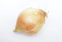 An Onion (Allium Cepa) In Natura, On A White Background For Clipping, Still With The Peel And Where You Can See The Hairs That Are Its Root