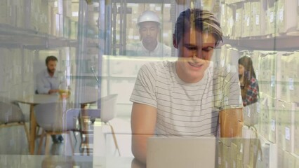 Poster - Animation of caucasian businessman working on laptop and african american worker driving forklift