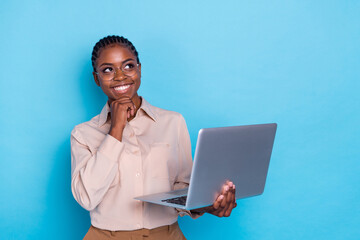 Photo of dreamy intelligent young programmer brainstorming generate new ideas isolated on blue color background