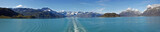 Fototapeta Natura - Panoramic view of Glacier Bay National Park from the stern of a cruise ship (prop wash in water)  - Just 250 ears ago this bay was all ice and extended 100 miles long and thousands of feet deep.