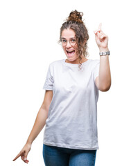 Sticker - Beautiful young brunette curly hair girl wearing glasses over isolated background pointing finger up with successful idea. Exited and happy. Number one.