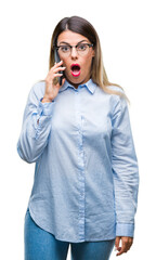 Sticker - Young beautiful business woman speaking calling using smartphone over isolated background scared in shock with a surprise face, afraid and excited with fear expression