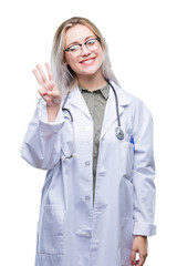 Poster - Young blonde doctor woman over isolated background showing and pointing up with fingers number three while smiling confident and happy.