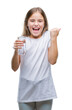 © Krakenimages.com - Young beautiful girl drinking glass of water over isolated background screaming proud and celebrating victory and success very excited, cheering emotion