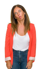 Sticker - Beautiful middle age business adult woman over isolated background making fish face with lips, crazy and comical gesture. Funny expression.