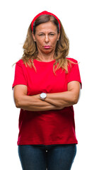 Sticker - Middle age senior hispanic woman over isolated background skeptic and nervous, disapproving expression on face with crossed arms. Negative person.