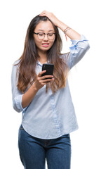 Sticker - Young asian woman texting using smartphone over isolated background stressed with hand on head, shocked with shame and surprise face, angry and frustrated. Fear and upset for mistake.