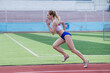 © Михаил Решетников - Young caucasian woman is engaged in jogging at the stadium outdoors.