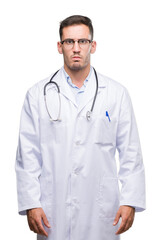 Poster - Handsome young doctor man skeptic and nervous, frowning upset because of problem. Negative person.