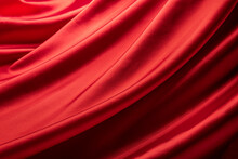 ドレープのある赤いシルクの布の背景テクスチャー