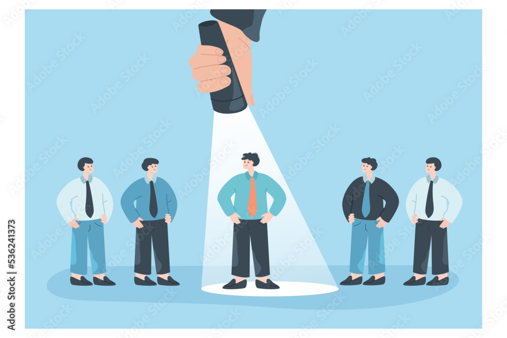 Spotlight on businessman chosen from crowd of employees. Hand with ...