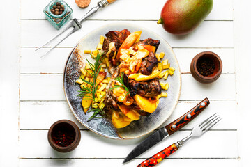 Wall Mural - Baked meat with mango