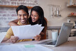 © N Lawrenson/peopleimages.com - Home finance, budget and documents of couple with fintech, digital bank or entrepreneurship profit invoice. Happy people reading mortgage paperwork, tax management or financial house savings planning