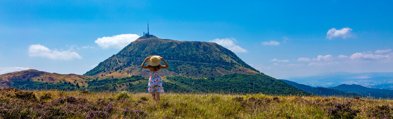 Wall Mural - Rear view of woman tourist in Auvergne,  Puy de Dome in France