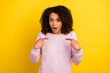 © Tetiana - Photo of young astonished lady indicate fingers herself puzzled offended isolated over yellow color background