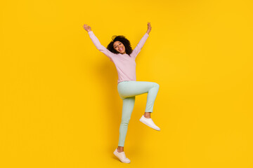 Wall Mural - Full length profile side photo of young pretty woman good mood playful isolated over yellow color background