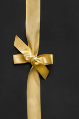 Canvas Print - Golden ribbon on black