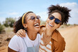 © S Fanti/peopleimages.com - Girl friends, hug and travel summer vacation outdoors on safari. Diverse happy gen z women friendship, love embrace and support or comic care free together on holiday fun lifestyle activity