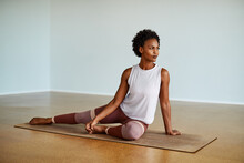 Young Young Woman Stretching Before Yoga Class