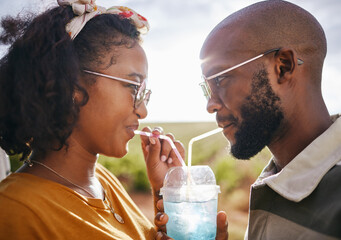 Wall Mural - Love, share and drink with straw and couple in nature for travel, countryside and sunset date on Madrid vacation. Happy, summer and romance with black man and woman drinking together on holiday