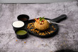 Rajasthani Shahi Raj-Kachori, stuffed with potato and sprout filling. served with curd, chutney and sev in a plate