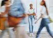 © Siphosethu Fanti/peopleimages.com - Anxiety, fear and a woman in busy crowded university sad and thinking. Stress, doubt and depression, student in hallway before interview, exam or class. Motion blur, people and girl waiting in lobby.