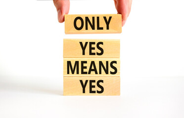 Wall Mural - Only yes means yes symbol. Concept words Only yes means yes on wooden blocks on a beautiful white table white background. Businessman hand. Business, psychological only yes means yes concept.