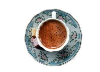 Wall Mural - A cup of foamy Turkish coffee on a yellow background