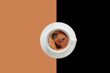 Wall Mural - A cup of frothy Turkish coffee on a brown and black background