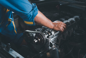 Sticker - A mechanic is performing engine valve system repairs on a vehicle.