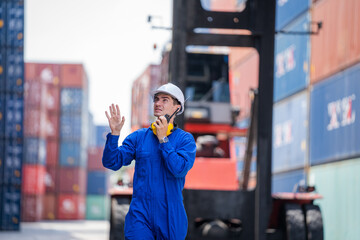 Poster - Foreman control forklift unloading truck at the container yard warehouse.