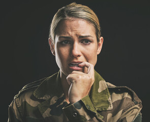 Wall Mural - Military, army and woman with ptsd, stress and face show anxiety, mental health or fear with black background. War, female or soldier frustrated bite nail and depression, sad and in uniform depressed