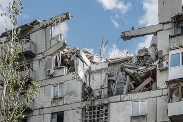 A fragment civilian building in Toretsk, Donetsk region, damaged by a Russian artillery shell (war concept)