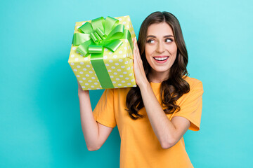 Sticker - Photo of young attractive gorgeous pretty lady curly hair wear orange t-shirt excited look her new surprise gift birthday good mood isolated on cyan color background