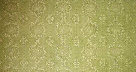 old wallpaper on the wall. old wallpaper for texture or background.