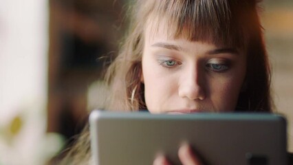 Poster - Coffee, tablet and creative employee on the internet while planning a marketing project at work. Face of an advertising designer working on creativity on web with drink of tea at a startup company