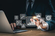 © Thapana_Studio - concept of long-term business development and management Executives looking at virtual screens business graph icon Goal setting, problem-solving, workflows, optimal business operations and innovation.