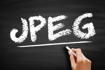 Fototapete - JPEG Joint Photographic Experts Group is an group of experts that develops and maintains standards for a suite of compression algorithms for computer image files, acronym text on blackboard