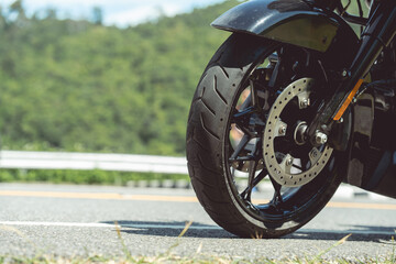 Classic american motorcycle. motorcycle in a sunny motorbike on the road riding.with sunset light. copy space for your individual text.On the road. Wheel bike.