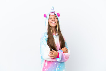 Poster - Little caucasian girl wearing unicorn pajama isolated on white background happy and smiling