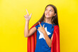 © luismolinero - Little caucasian superhero girl isolated on yellow background pointing with the index finger a great idea