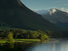 The Sun Lights Up Trees On The Shore Of Wastwater In The Lake District