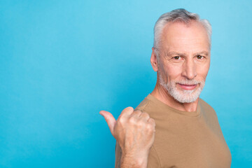 Sticker - Close up photo serious calm virile man wear pastel stylish outfit arm direct empty space recommendation isolated on blue color background