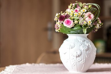 Wall Mural - Closeup of a beautiful bouquet in a white vase.