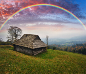 Wall Mural - Rainbow over the Mountains. autumn morning in the Carpathians. Nature of Ukraine